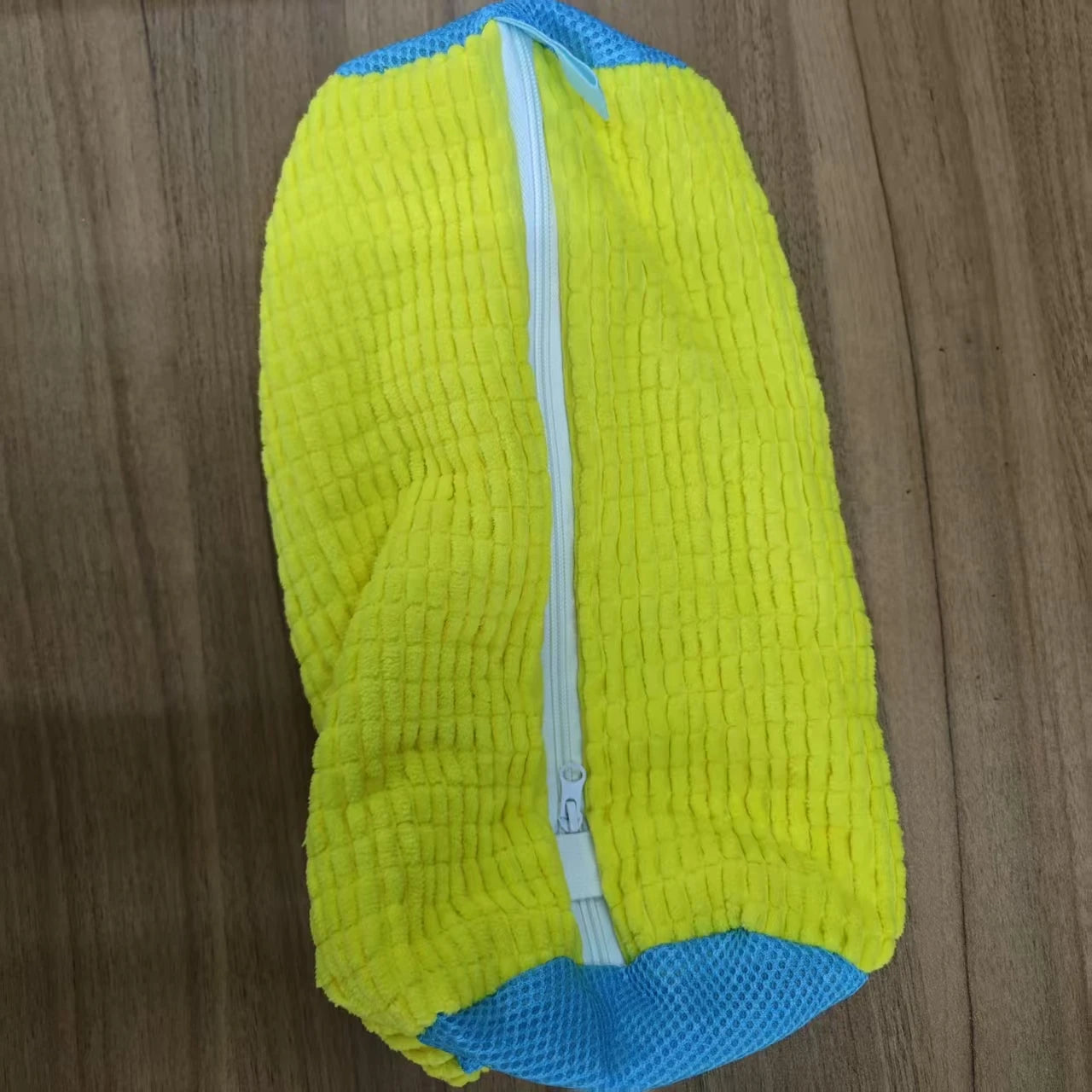 Yellow microfiber shoe washing bag with blue zipper